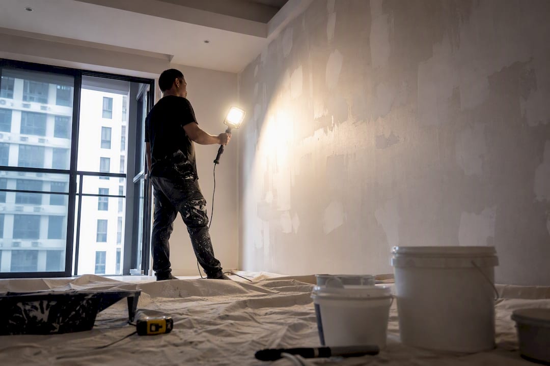 Work light showing patchy wall under raking light