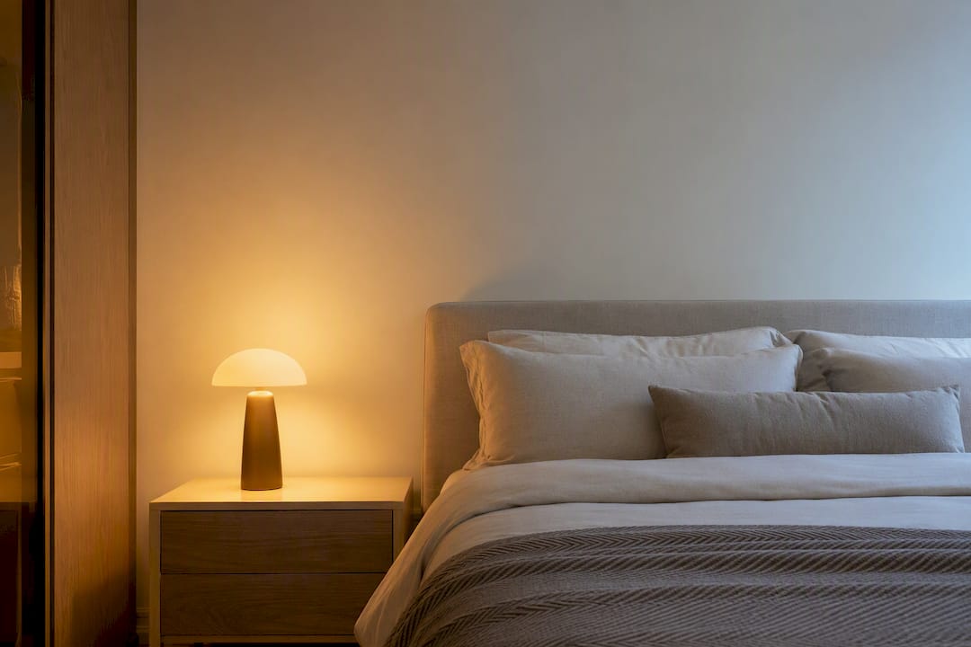Bedroom wall under warm evening lamp light